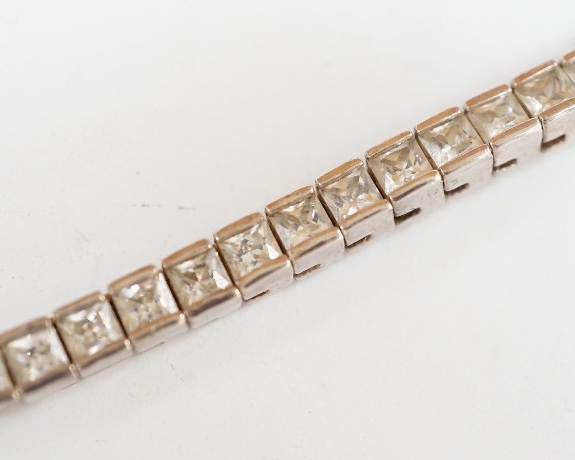 A modern 925 and simulated diamond set line necklace, 41cm, and two pairs of 925 and simulated gemstone set ear studs. Condition - poor to fair